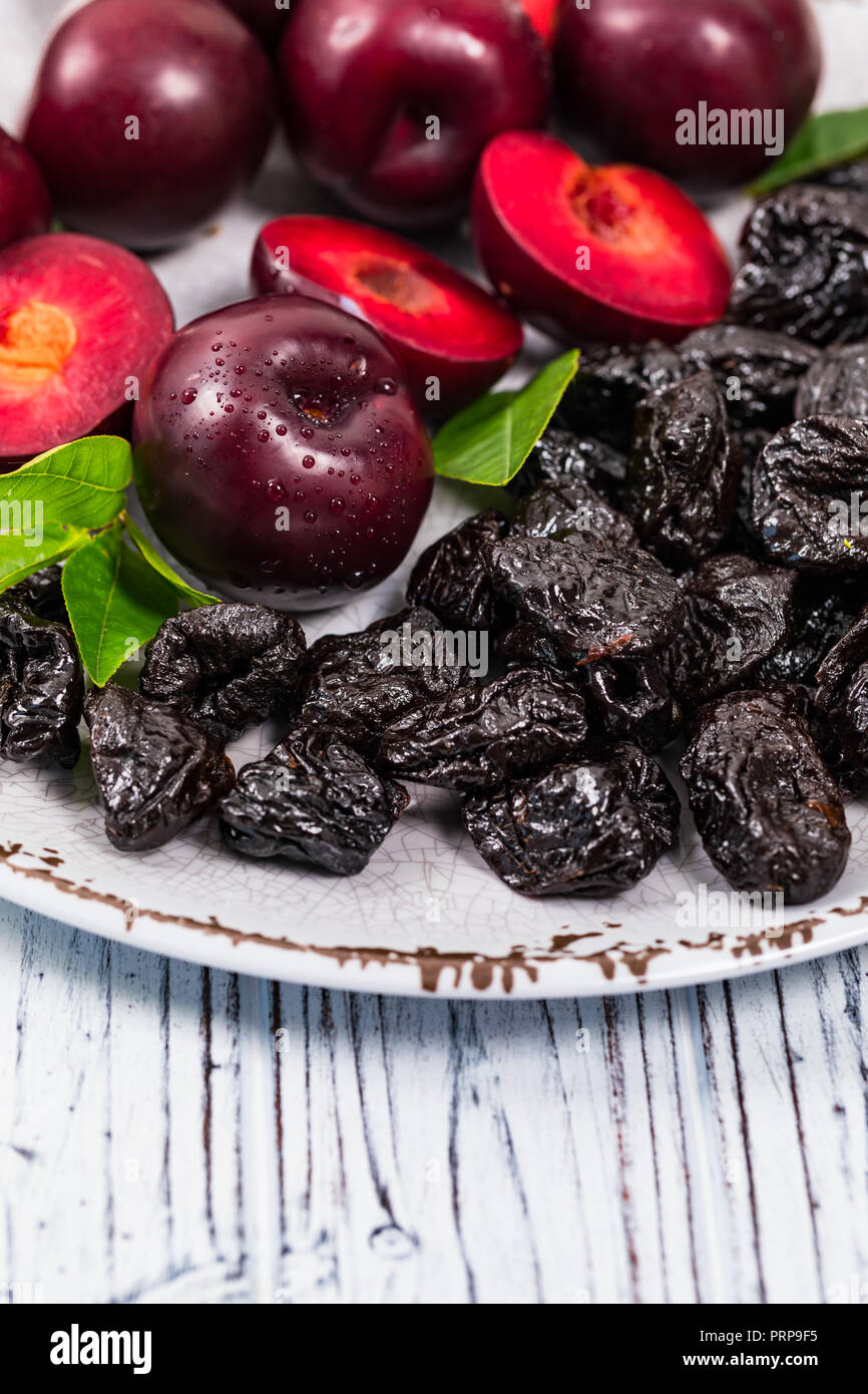 Dried Plums Pitted Prunes and Fresh Plums Background Stock Photo Alamy