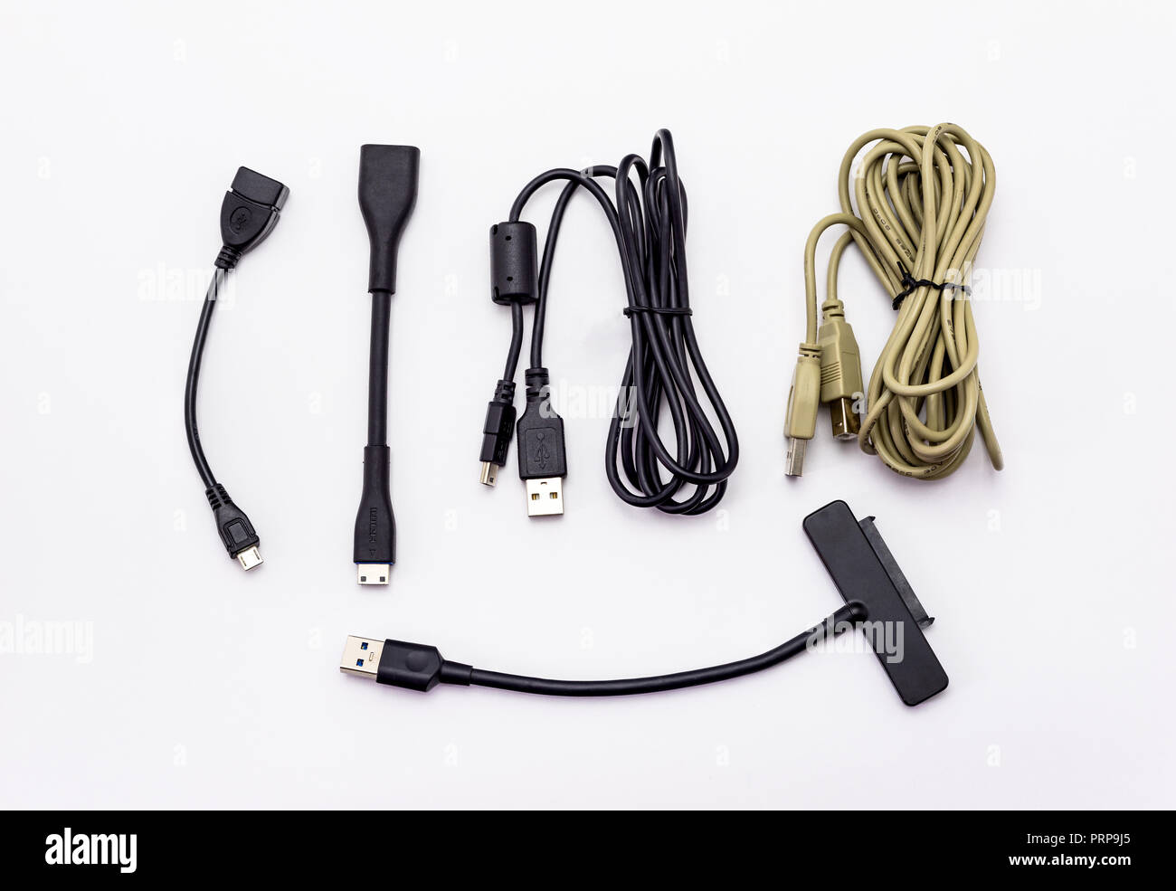Different types of USB cables. Isolated on a white background with a