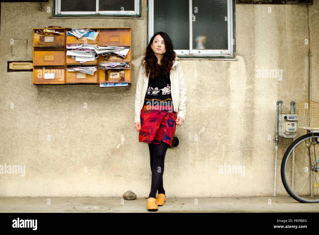 Japanese Girl poses on the street in Fussa, Japan. Fussa is a city