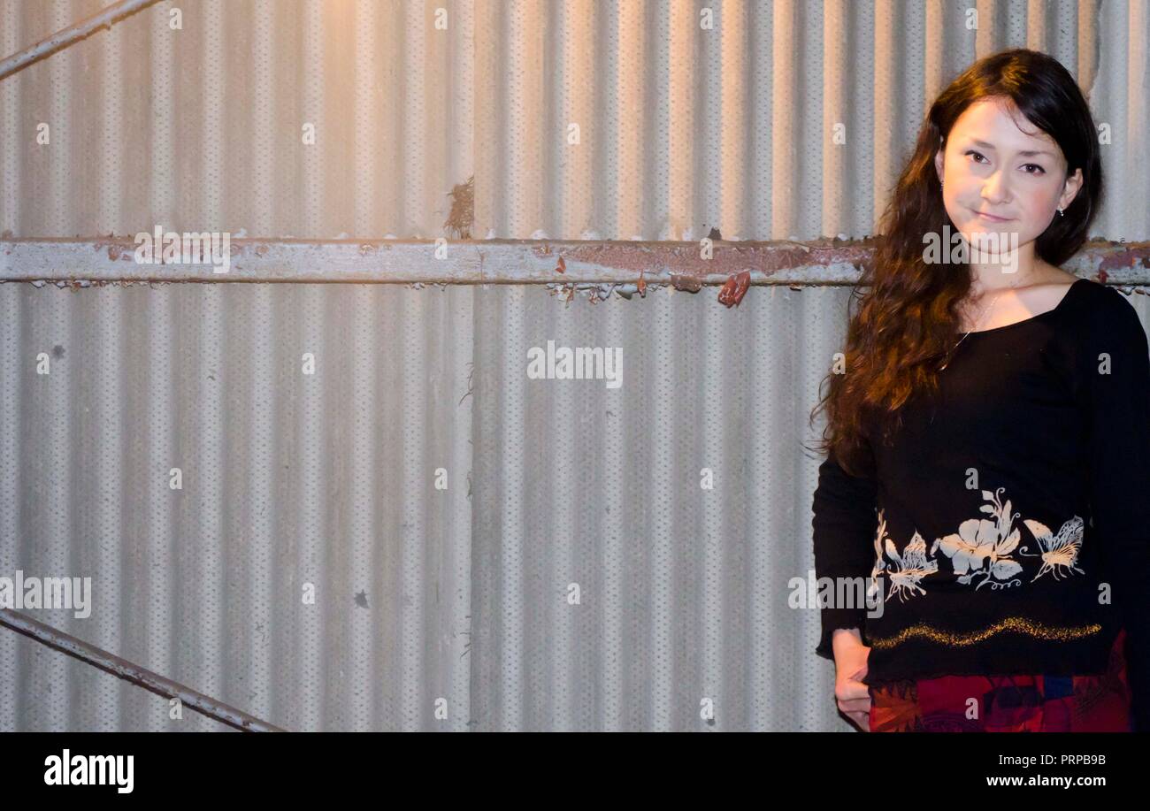 Japanese Girl poses on the street in Fussa, Japan. Fussa is a city