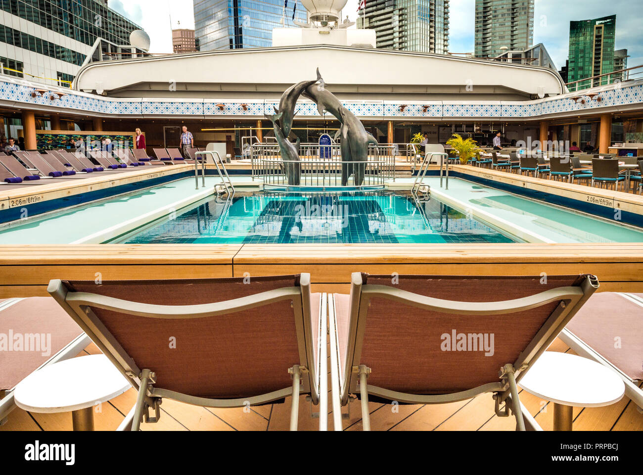 Lido Deck swimming pool under open retractable Magradome roof. The Volendam, Holland America R