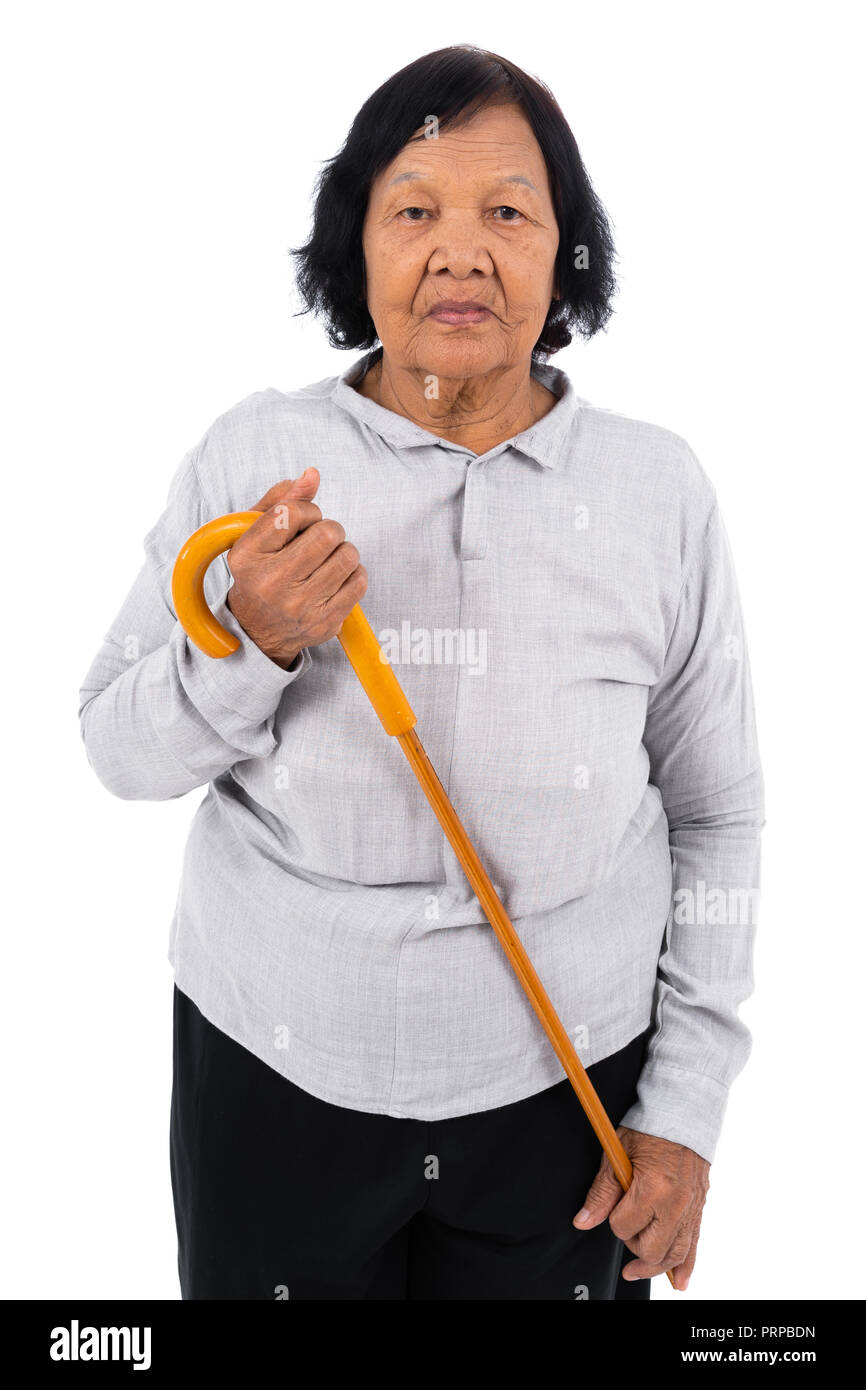 senior woman with a walking cane isolated on a white background Stock Photo