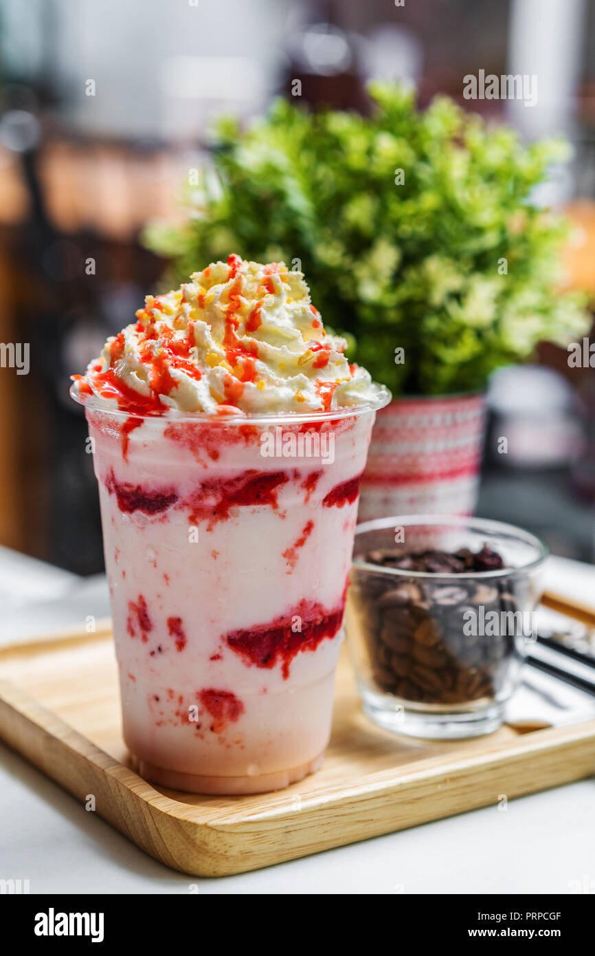 strawberry frappe with whipped cream on table Stock Photo