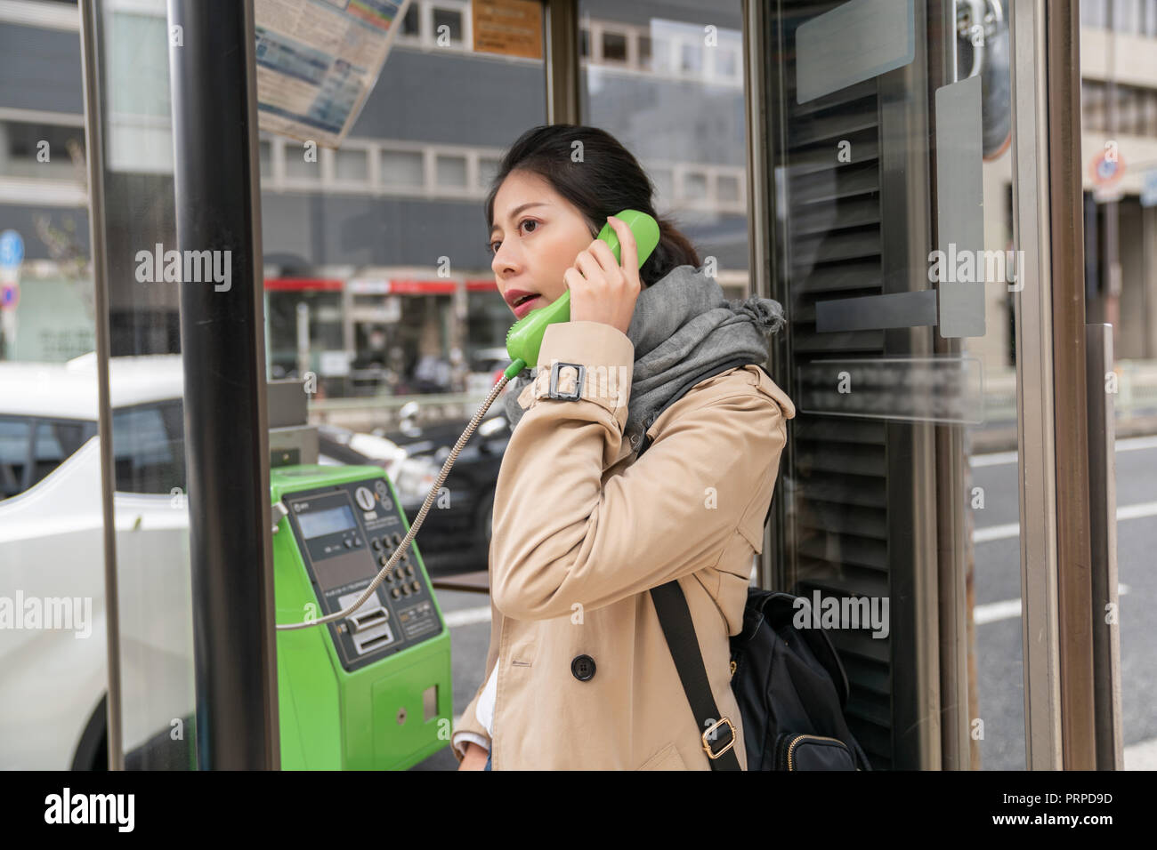 Телефоны малайзии. Японка и телефонная будка. Женщина в телефонной будке. Public Phone фото. Красивая азиатка с мобильным телефоном в общественном месте.