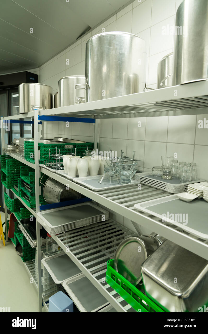 industrial restaurant kitchen with equipment needed for cooking and cleaning vertical view Stock Photo
