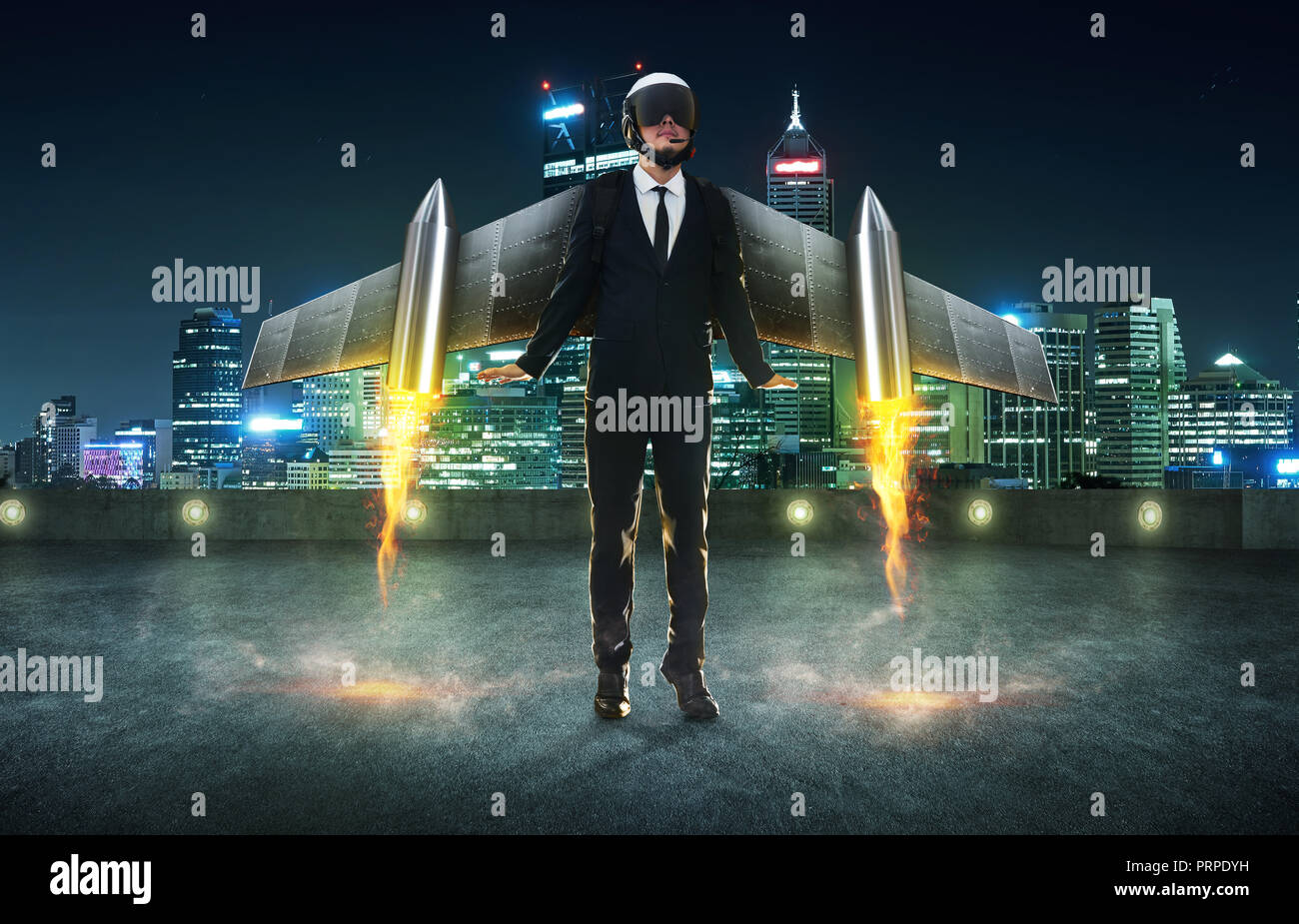 Businessman wear a rocket suit to lift , Business start up success concept . Modern city background . Stock Photo