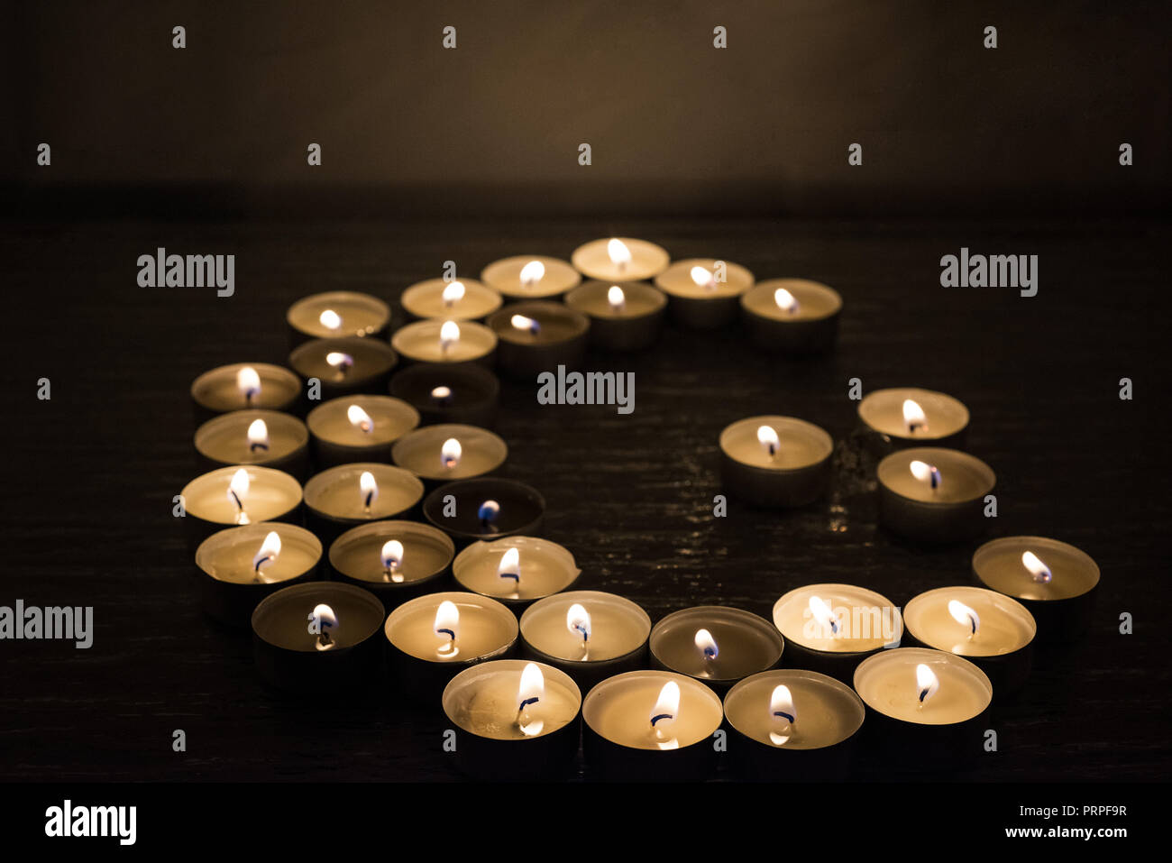 Symbols of Islam. Candle lights on black background. Abstract isolated