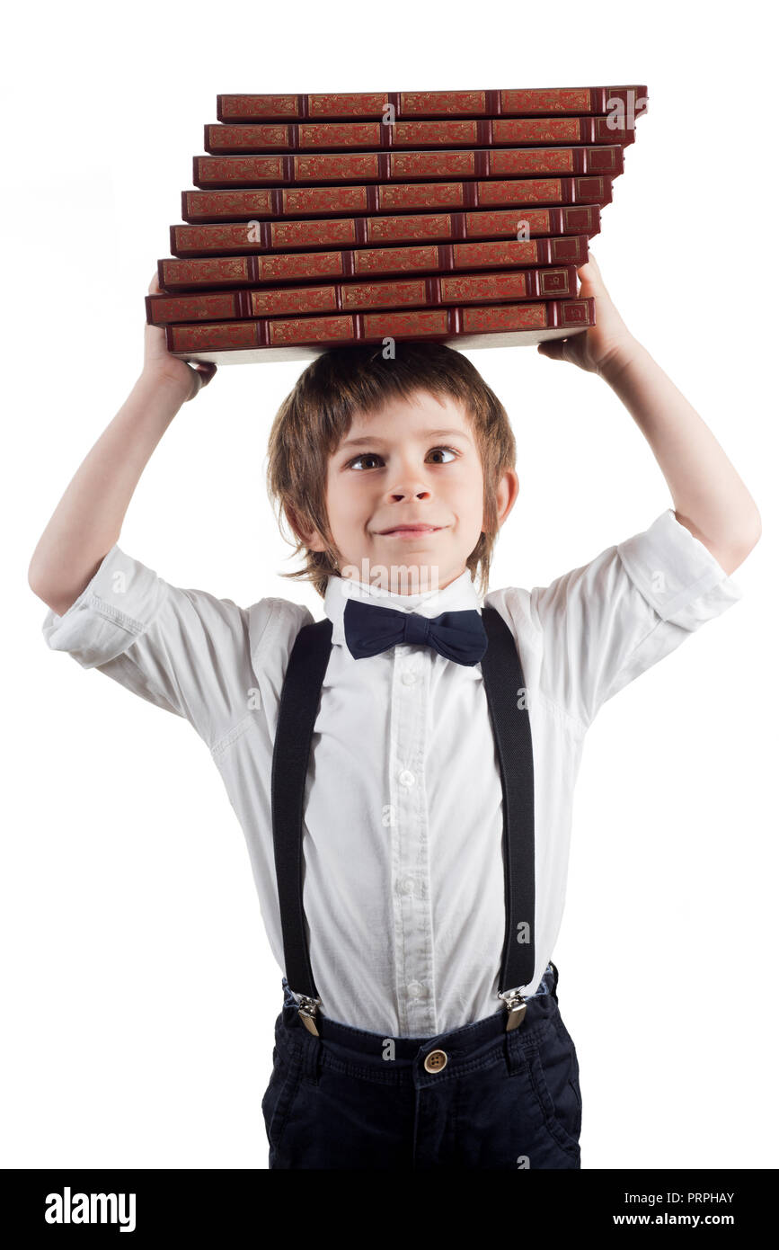 Child and the weight of the books Stock Photo