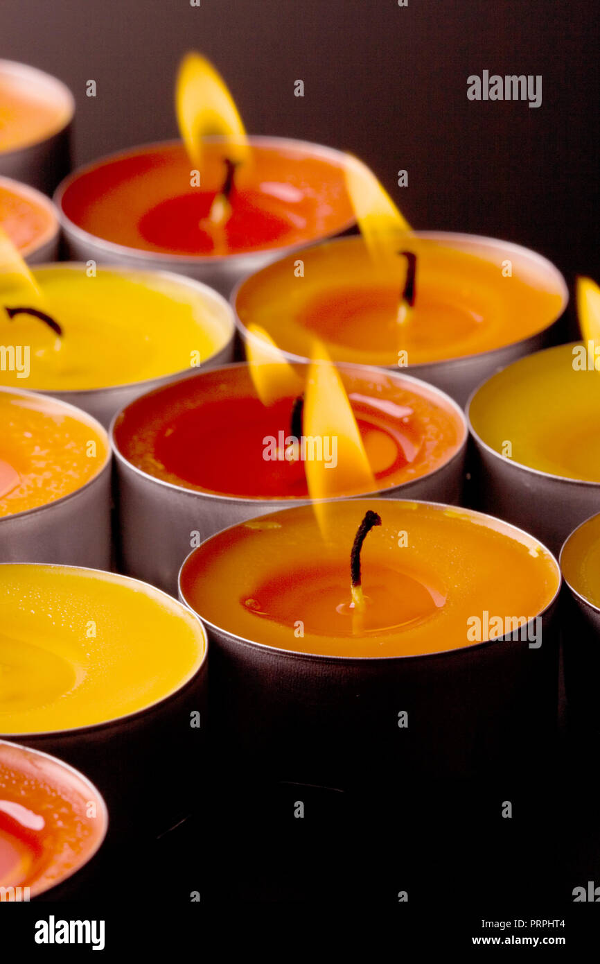 flaming candles on a dark background Stock Photo - Alamy