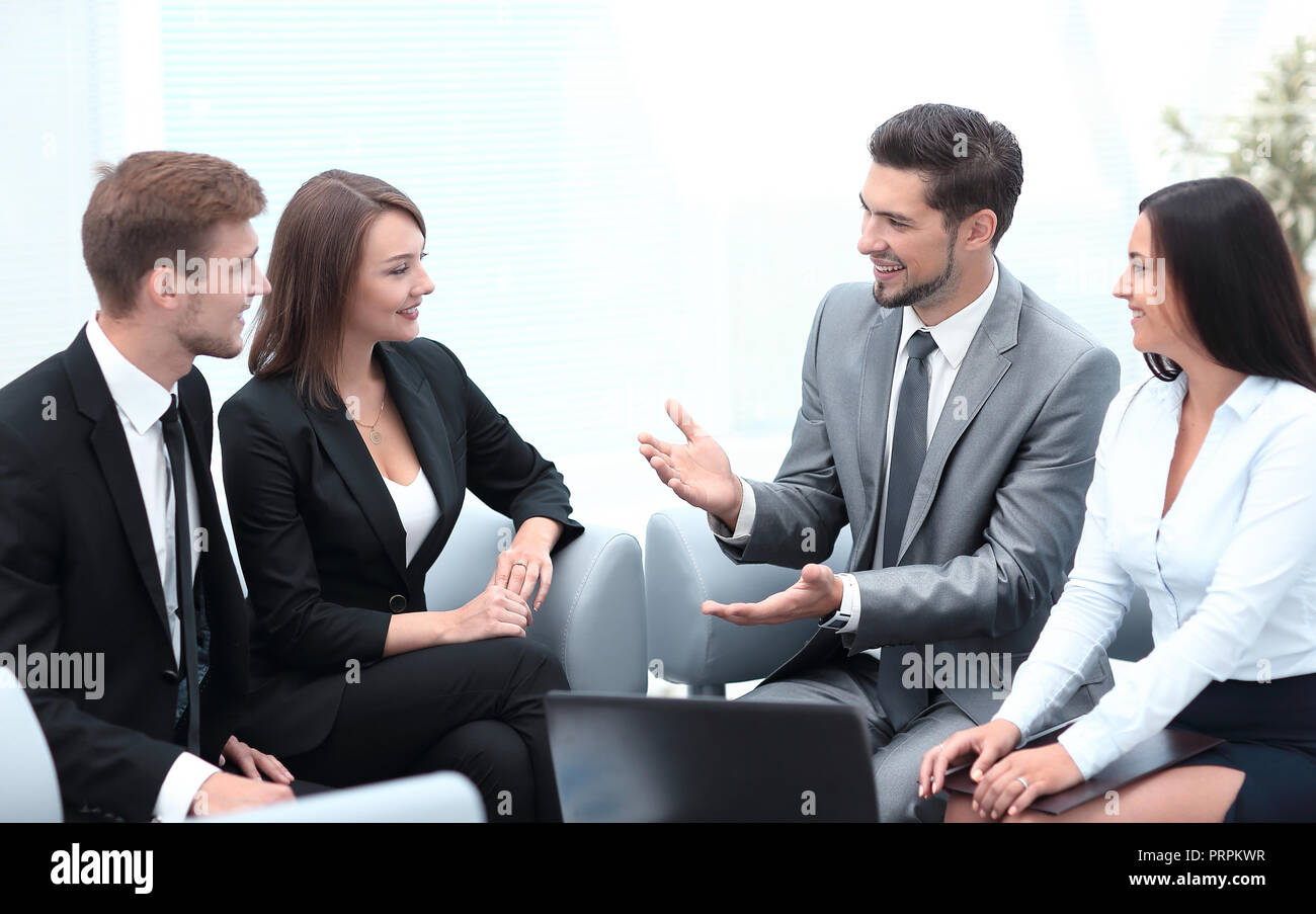 business team sitting in the lobby of the office Stock Photo - Alamy