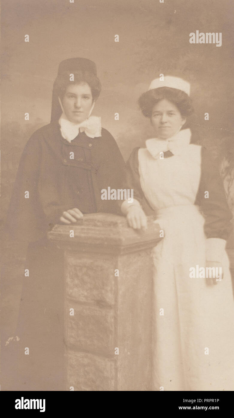 * Vintage Photograph of an Edwardian Midwife? and Edwardian Nurse or Maid Stock Photo