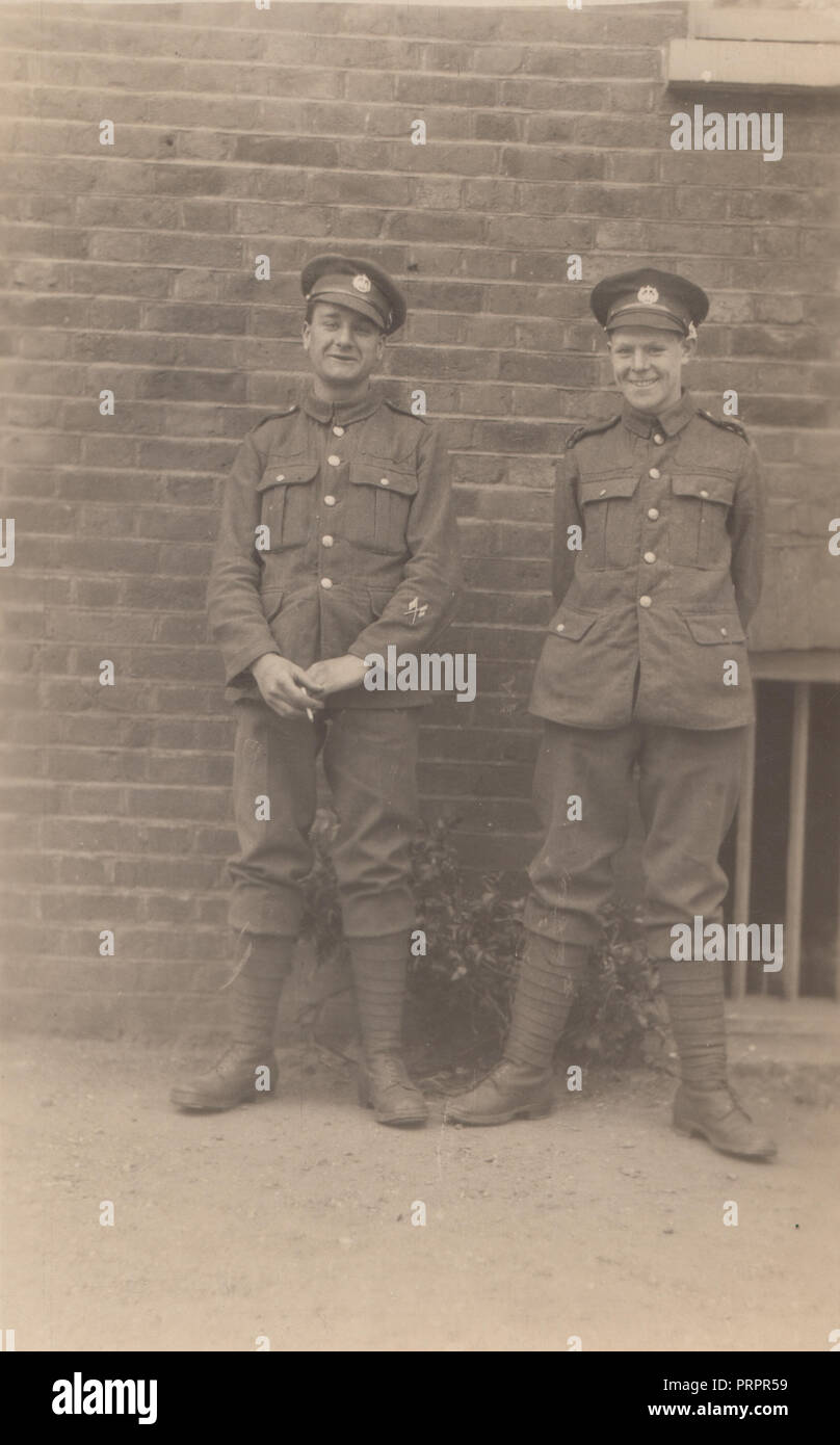 * Vintage Photograph of Two Laughing WW1 British Army Soldiers. One of The Soldiers is Having a Cigarette. Stock Photo