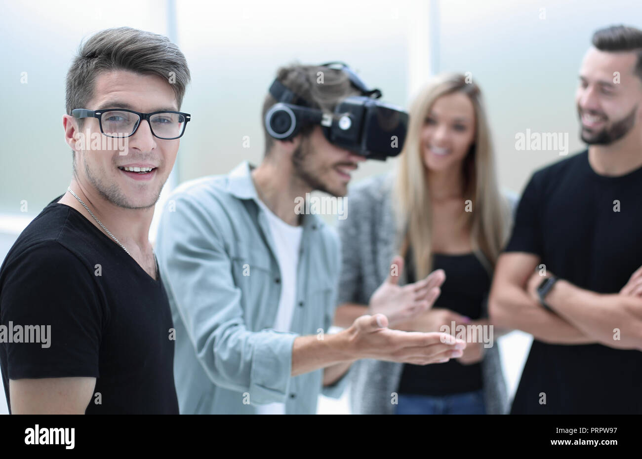 Positive colleagues testing virtual reality glasses Stock Photo