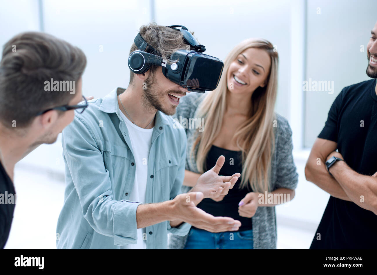 Positive colleagues testing virtual reality glasses Stock Photo