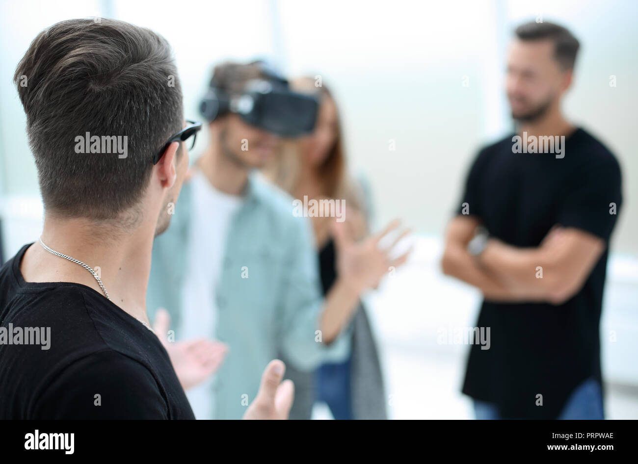 Positive colleagues testing virtual reality glasses Stock Photo