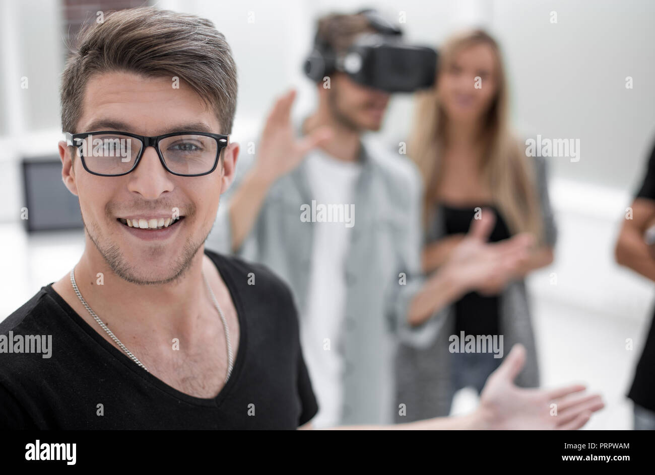 Business team using virtual reality headset in office meeting. Stock Photo