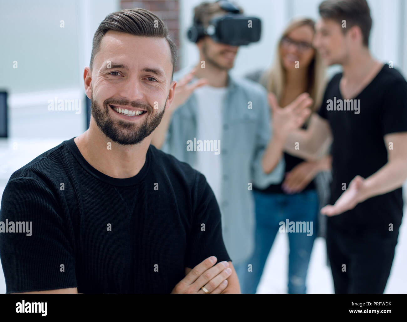 Cheerful colleagues testing virtual reality glasses Stock Photo