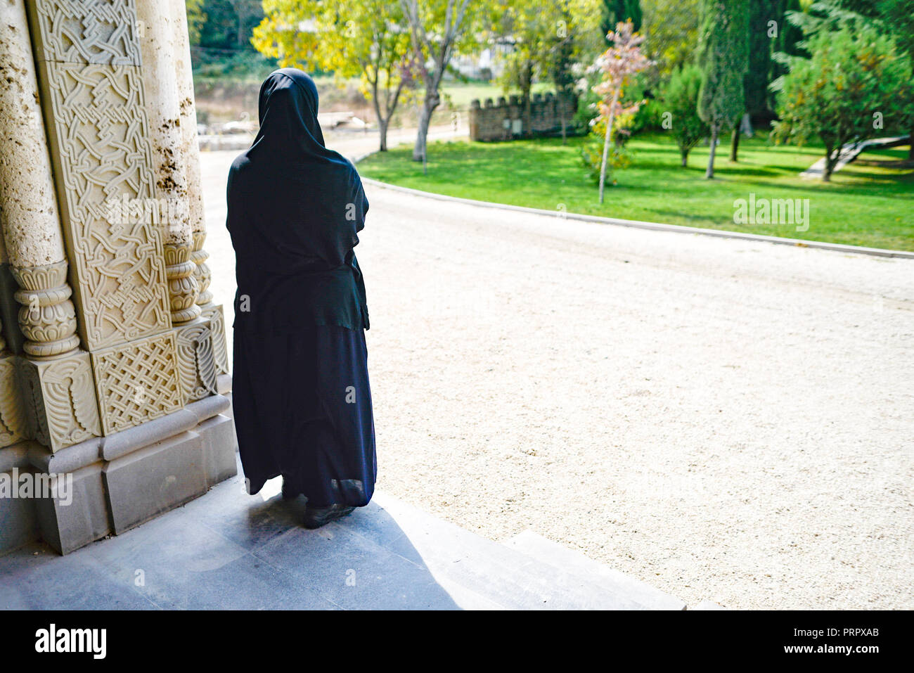 A nun observing the grounds at the Bodbe Covent Stock Photo - Alamy