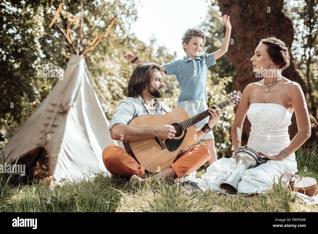 Happy nice family singing songs and dancing Stock Photo