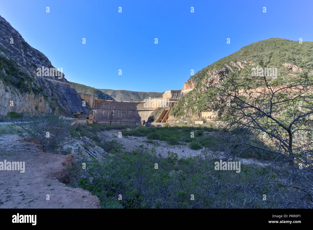 The full view of the dam wall without water flowing over it Stock Photo