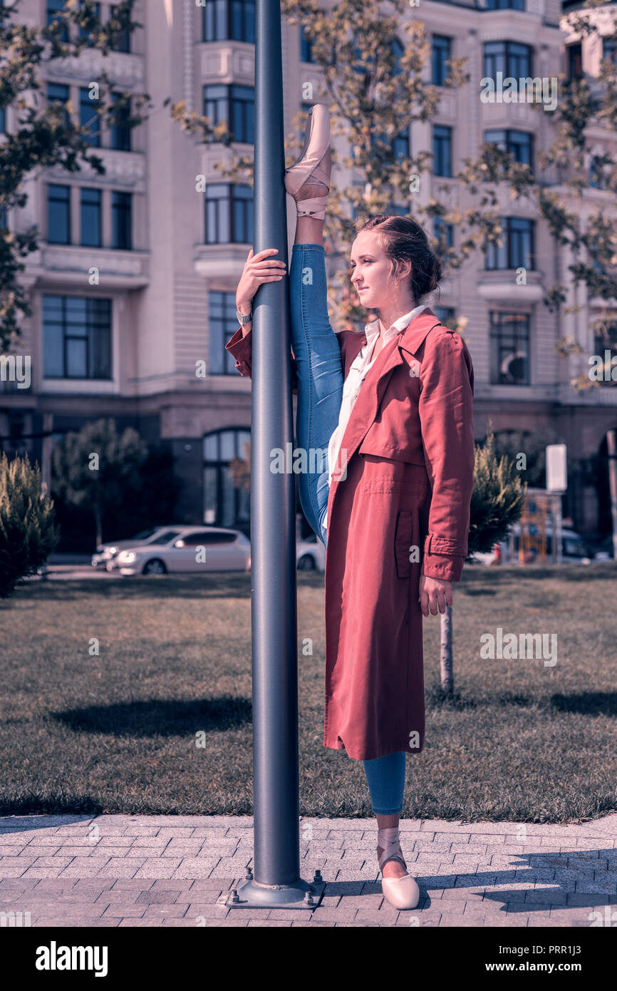 Nice skilled young woman showing her talent Stock Photo