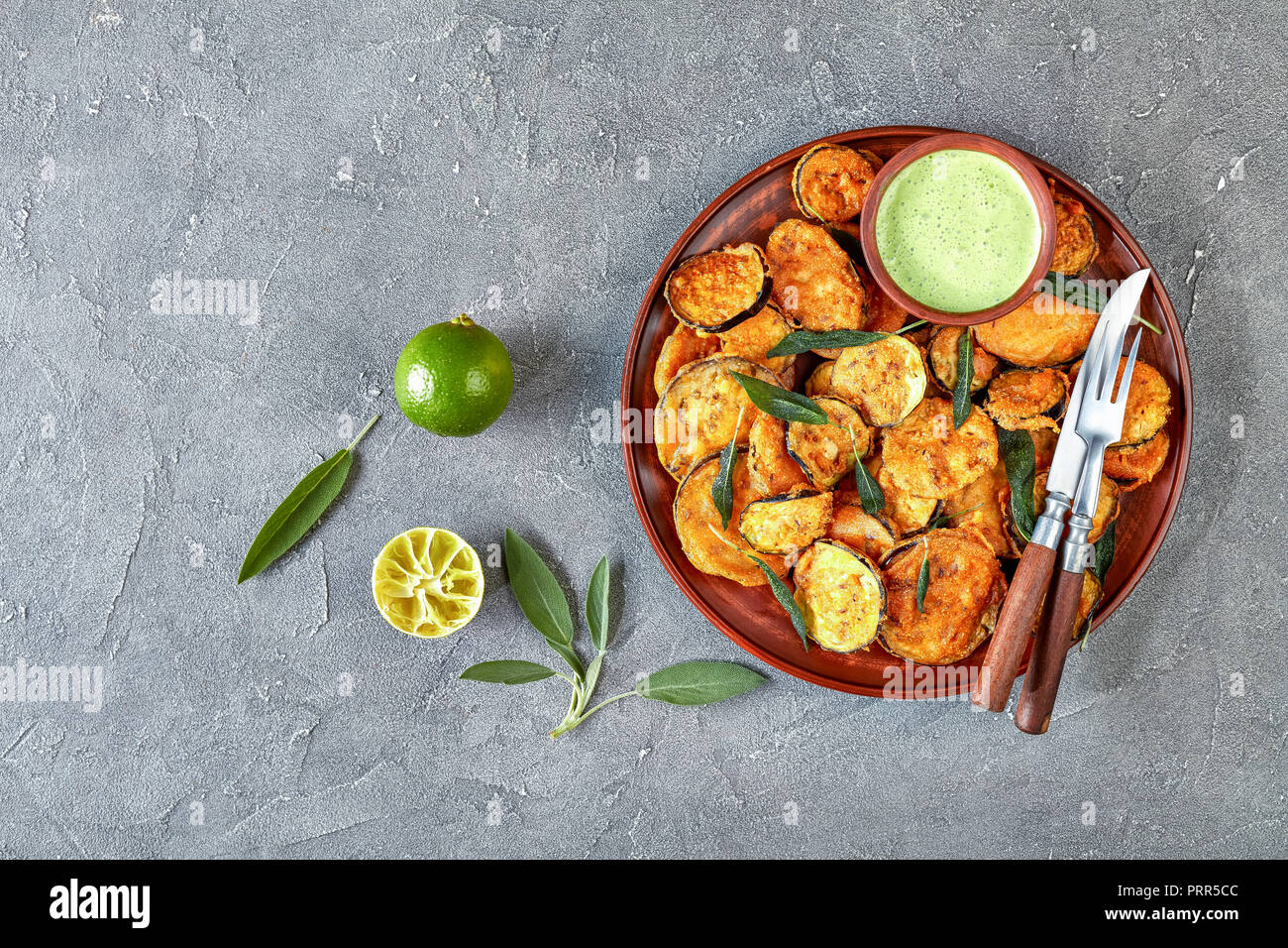breaded deep Fried Eggplant Aubergine slices on a earthenware plate