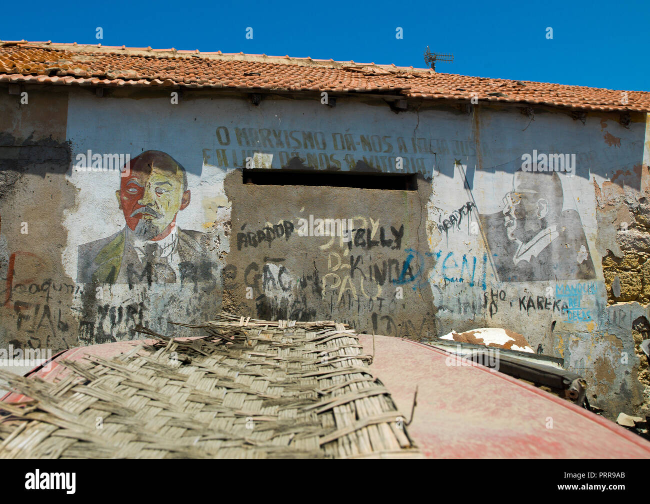 Old communist propaganda painted on a wall with lenin and jose eduardo dos santos, Namibe Province, Namibe, Angola Stock Photo