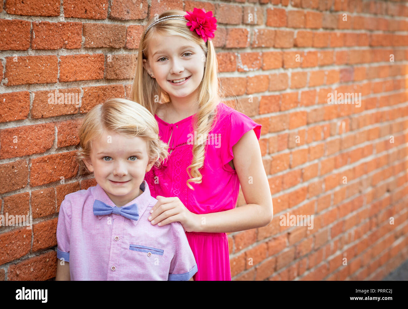 Cute Young Caucasian Brother and Sister Portrait. Stock Photo