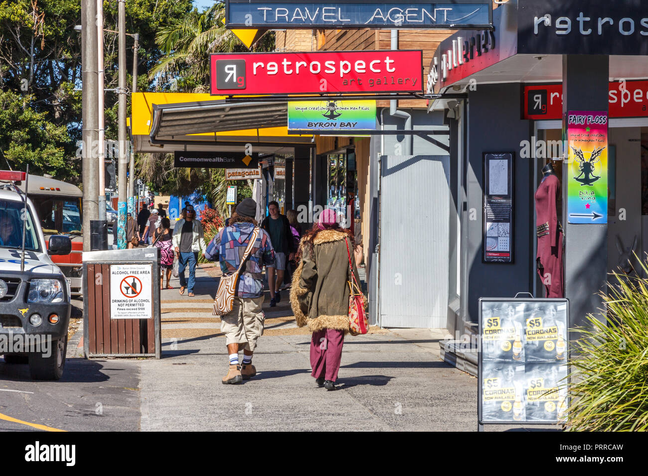 Byron Bay, Australia - 14th May 2015: People walking past an art gallery. The town is popular with young people. Stock Photo