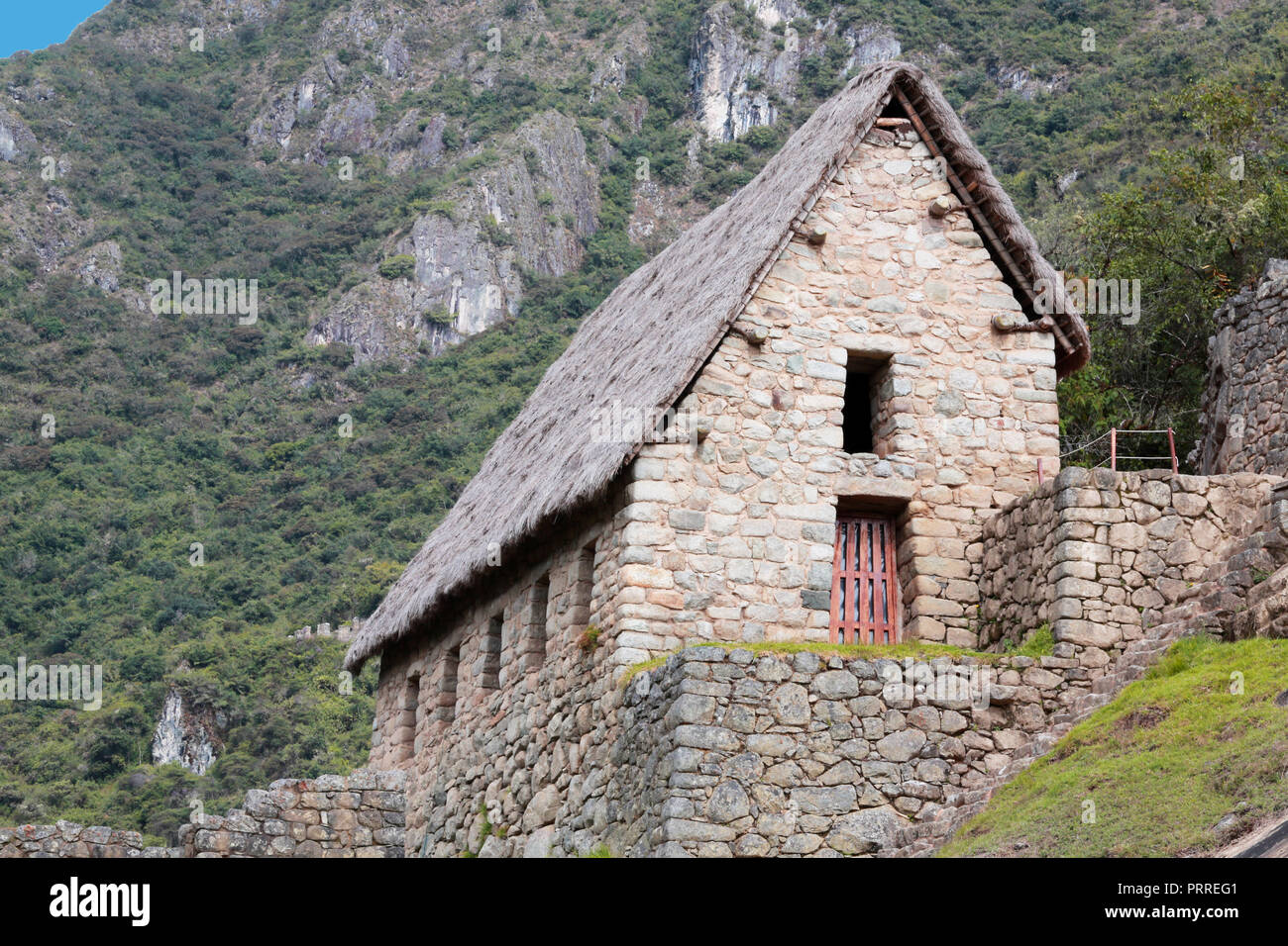 Inca stone structure with thatched roof Stock Photo