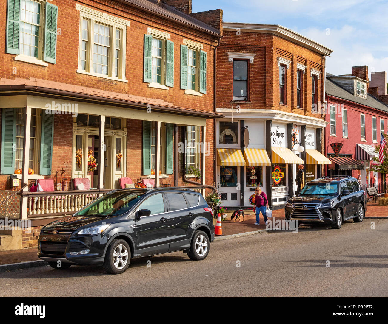JONESBOROUGH, TN, USA9/29/18 A woman and her dog walk along main