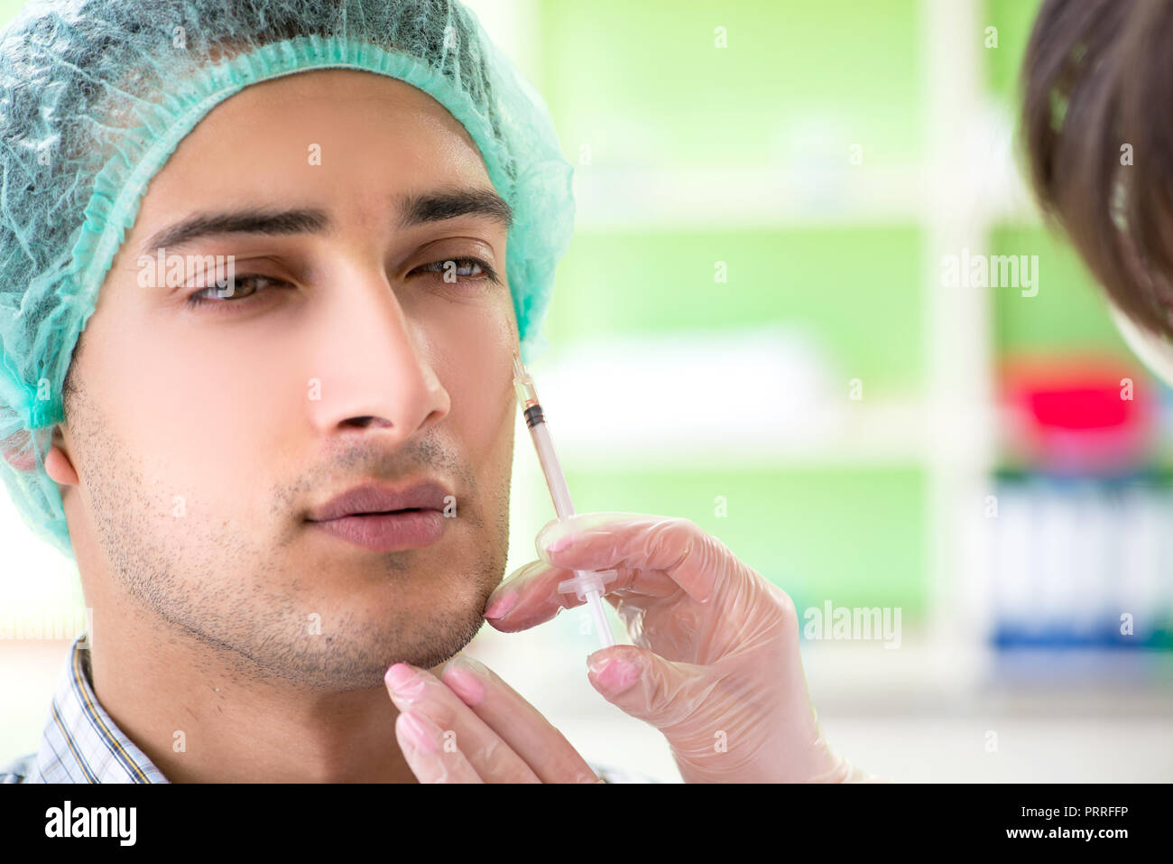 Plastic surgeon preparing for operation on man face Stock Photo - Alamy