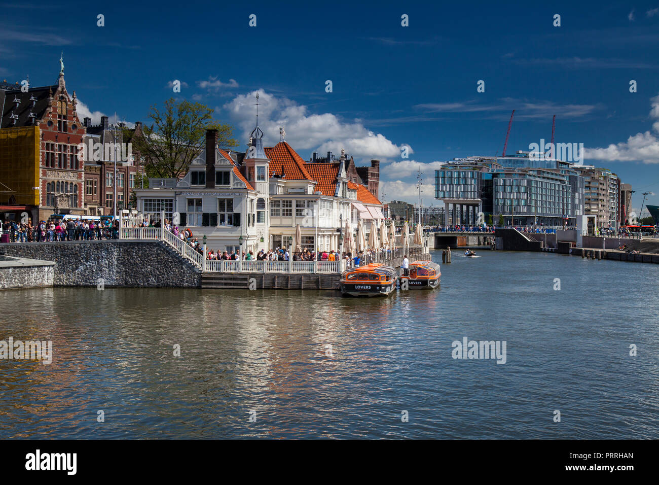 Boat dock for canal cruises at the Centraal Station, Amsterdam, The Netherlands Stock Photo