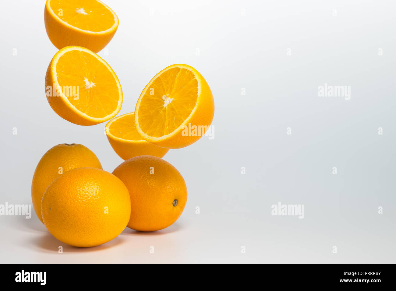 Heirloom navel orange levitate in mid air on white background Stock