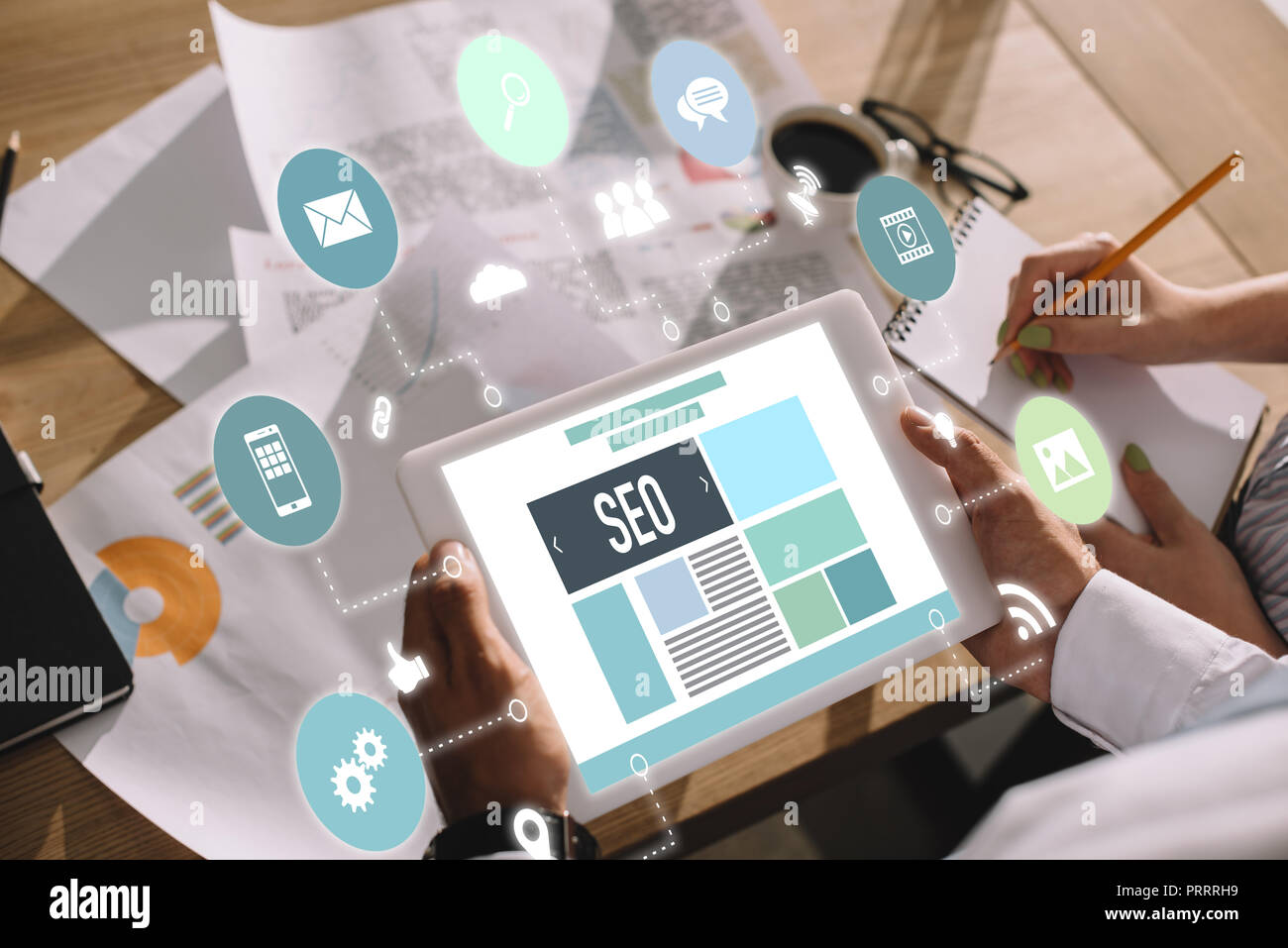 developers using digital tablet with SEO symbols and icons Stock Photo ...