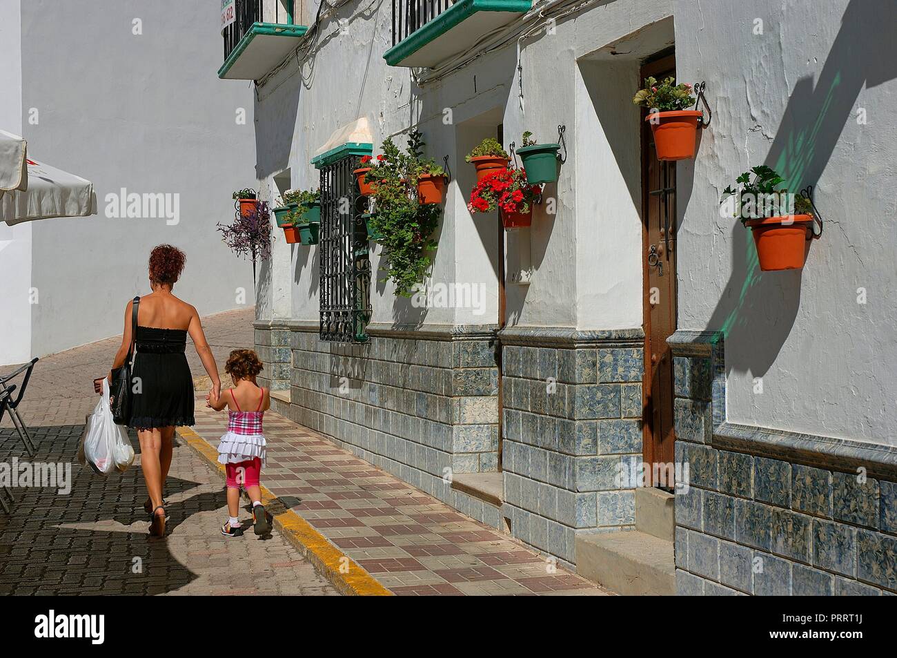 Urban view with flowerpots. Competa. Malaga province. Region of ...