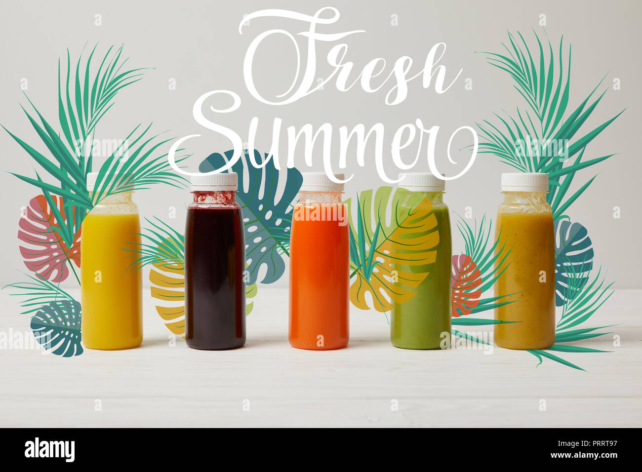 detox smoothies in bottles standing in row, refresh concept, fresh summer inscription Stock Photo