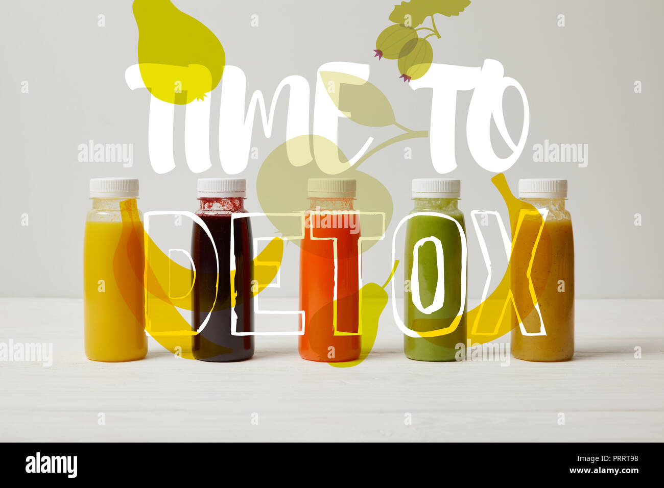 detox smoothies in bottles standing in row, refresh concept, time to detox inscription Stock Photo