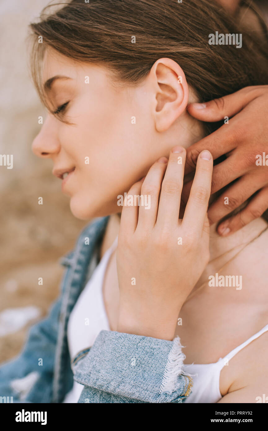 happy tender attractive girl and boyfriend touching her neck Stock