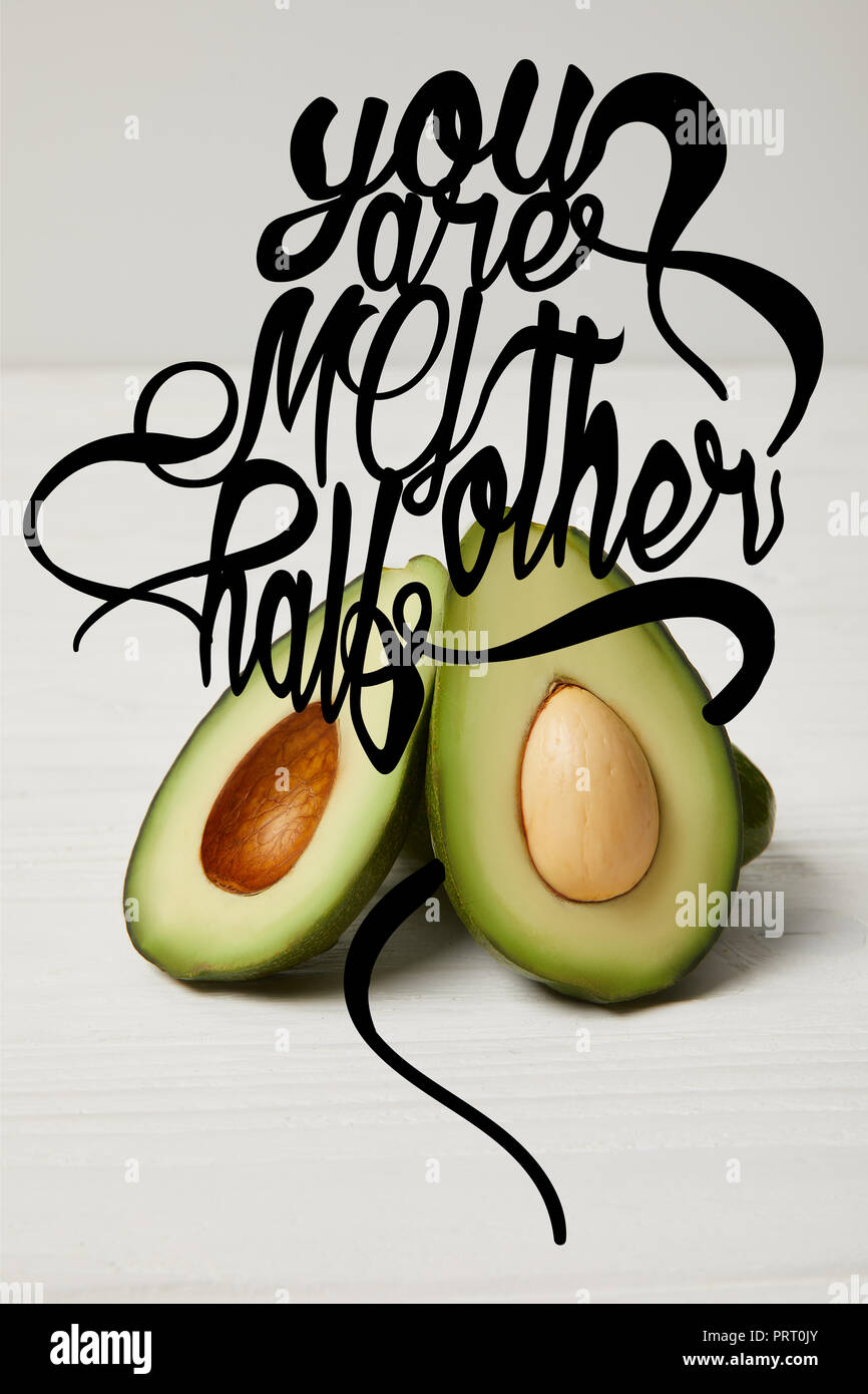 fresh green avocado, clean eating concept. 'You are my other half' lettering Stock Photo