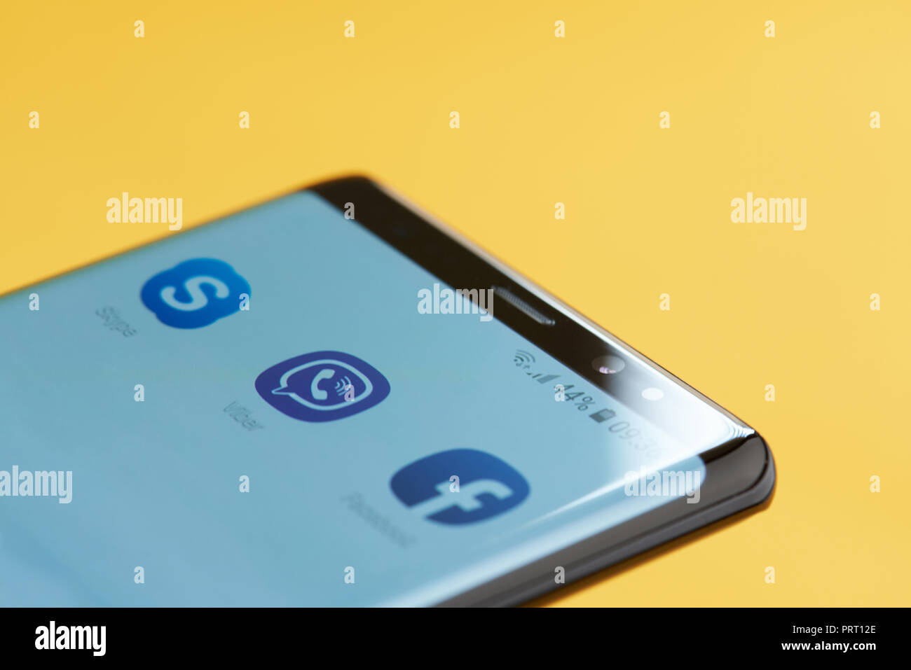 New york, USA - october 3, 2018: Viber icon app on smartphone screen close up view with yellow background Stock Photo