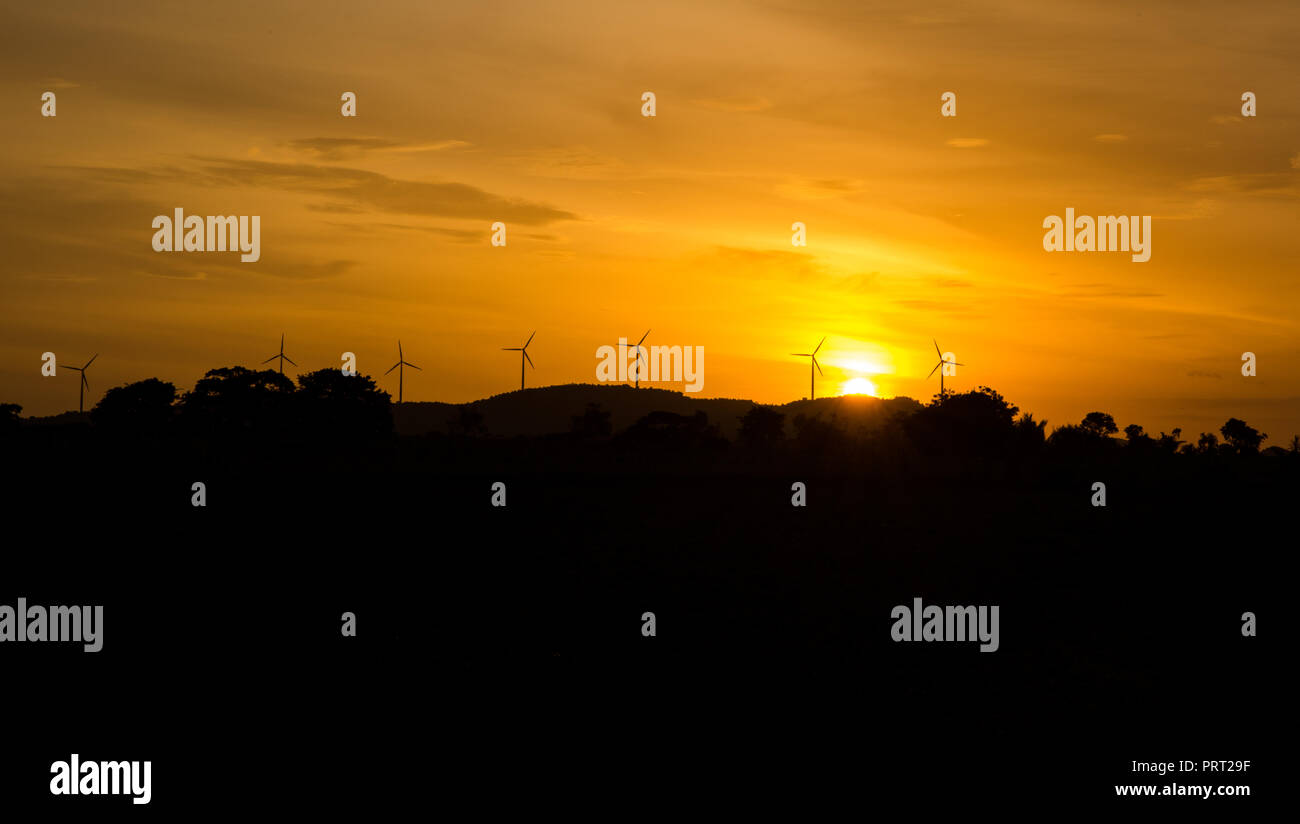 Wind turbines silhouette on mountain at sunset Stock Photo - Alamy