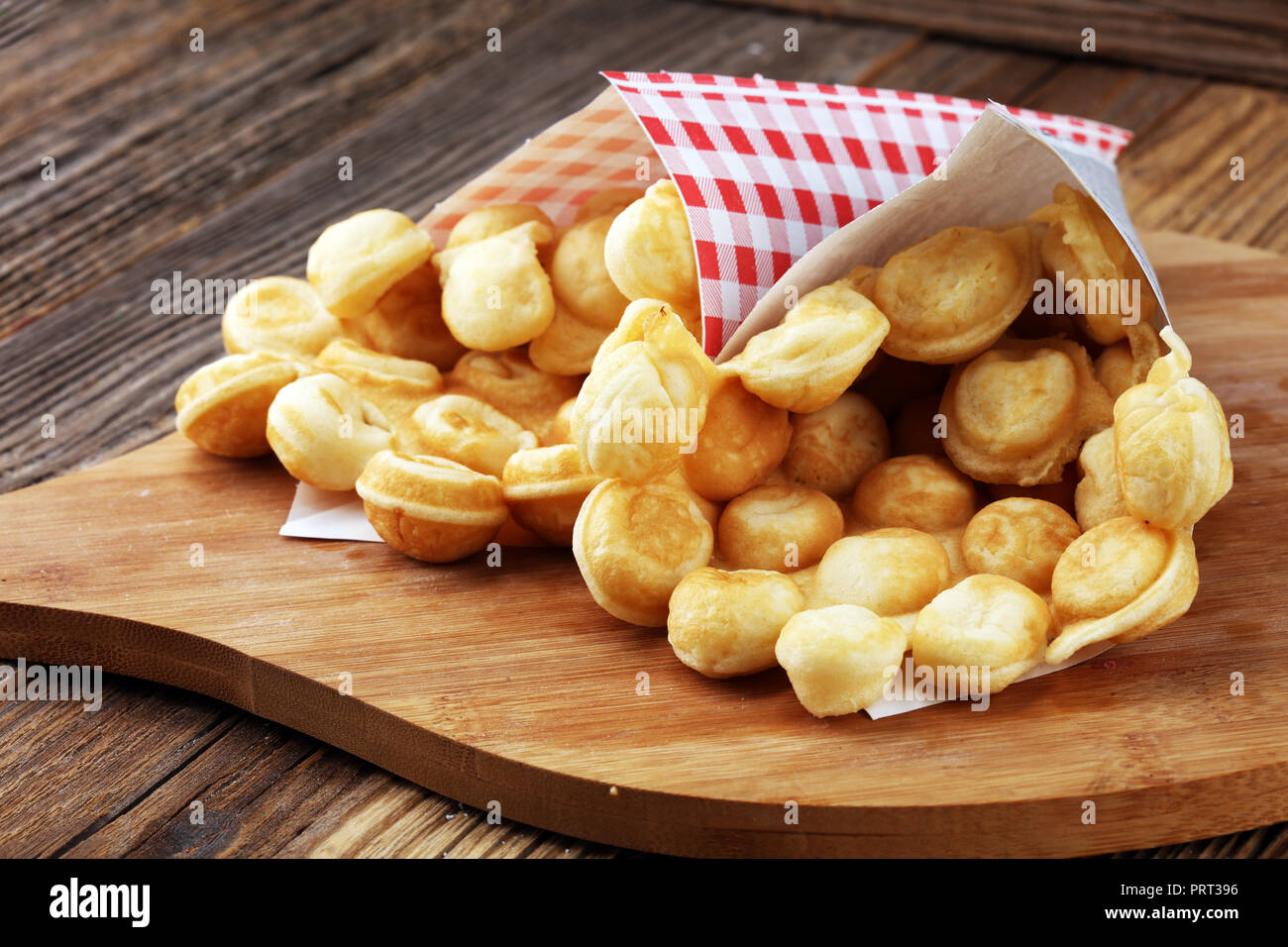 Hong Kong style egg waffle on wooden board. bubble waffle. street food