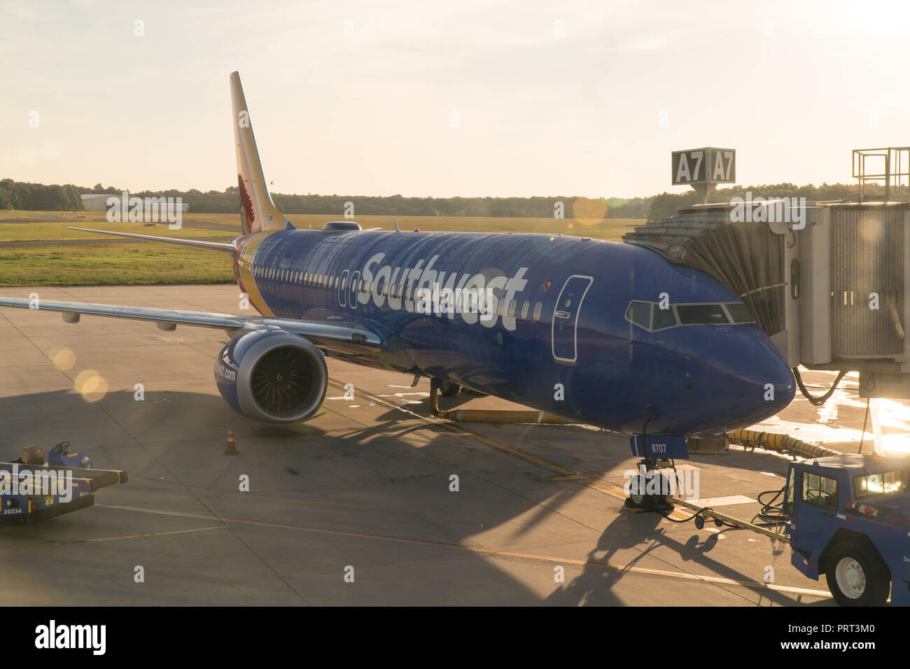 New York, USA - Circa 2018: Southwest airlines Boeing 737 airplane at terminal gate boaring passengers for early morning flight departure Stock Photo