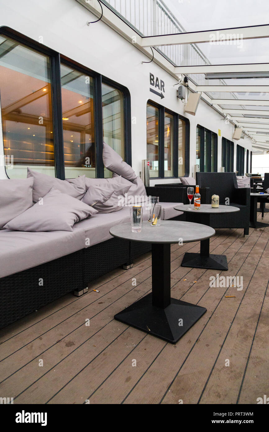 Editorial 08.09.2018 Stockholm Sweden, messy outer deck of a car ferry on the morning with garbage and empty glasses Stock Photo