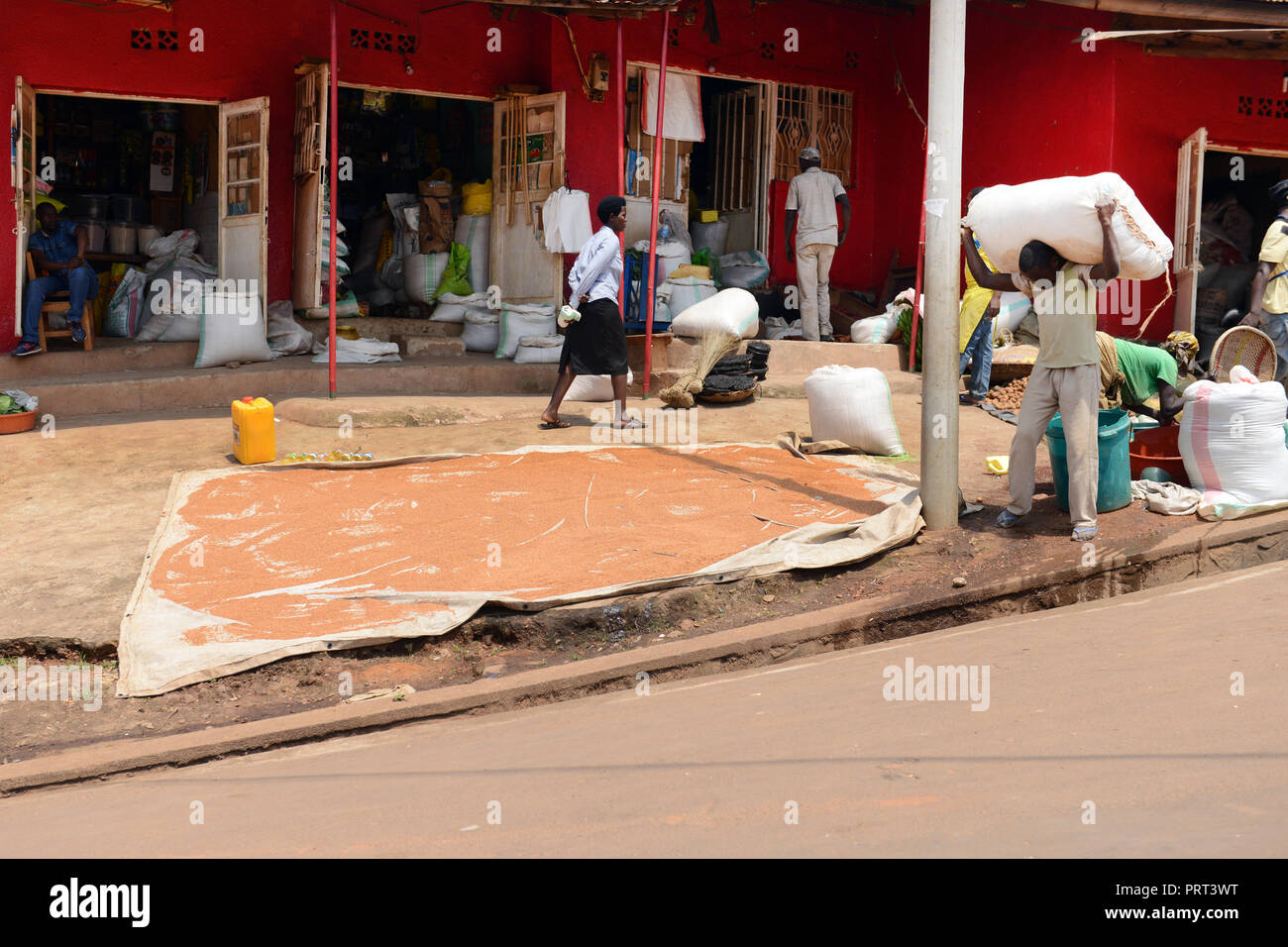 Drying millets by a shop in Kigali, Rwanda. Stock Photo