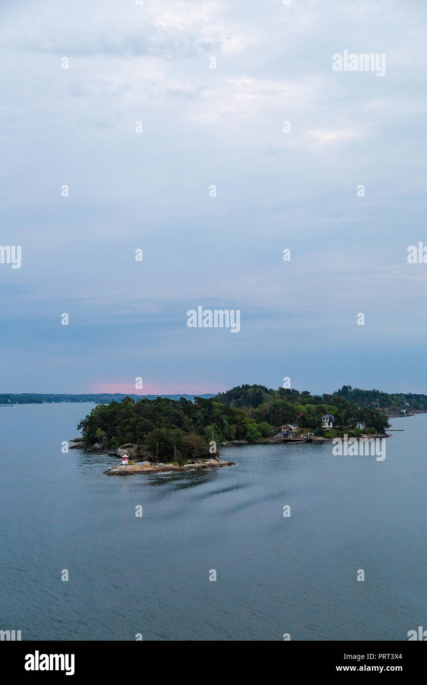 Houses and cottages in quiet Stockholm Archipelago with colorful trees