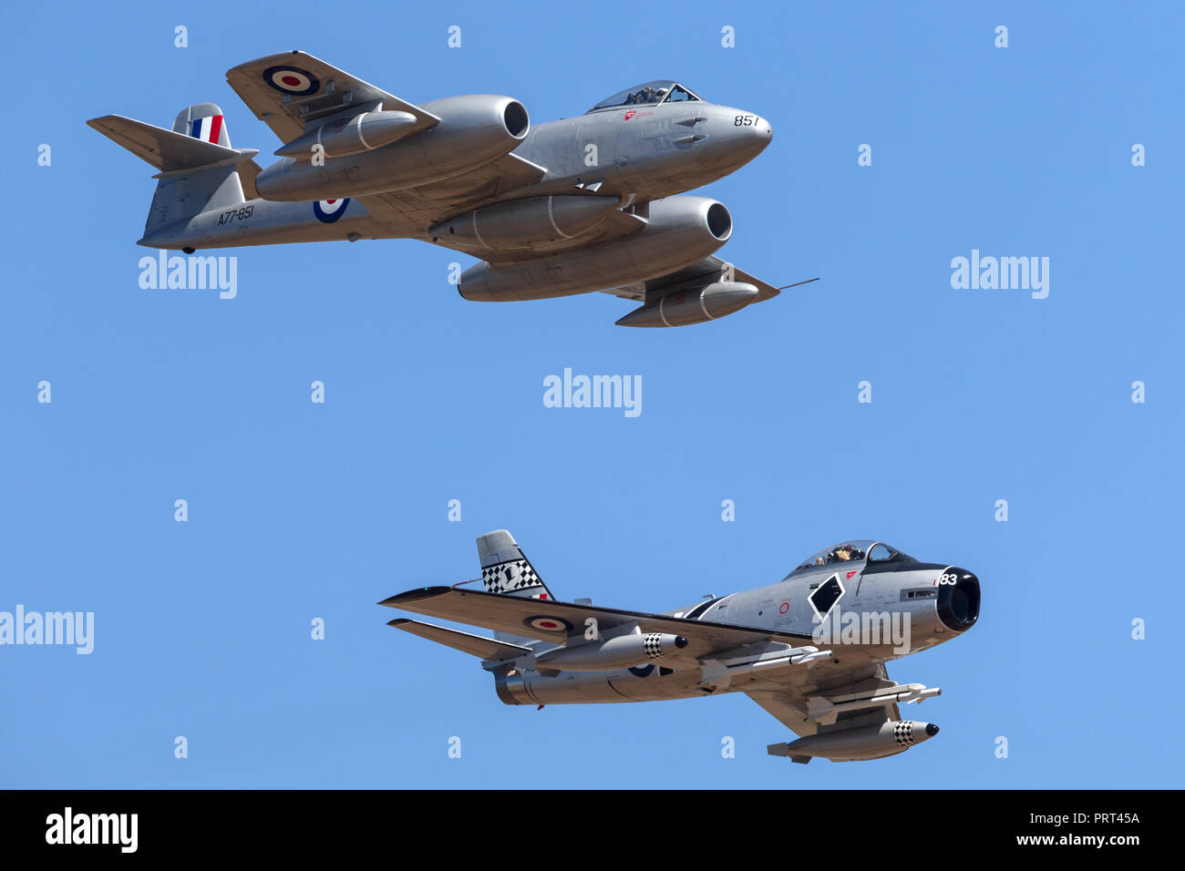 Gloster Meteor F.8 aircraft VH-MBX leading a CAC CA-27 Sabre (North American F-86) in formation. Stock Photo