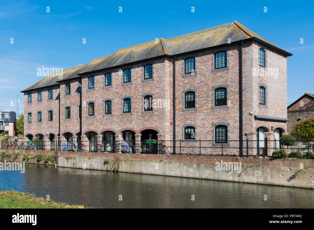 Apartment block alongside Chichester Ship Canal in Chichester, West Sussex, England, UK. Stock Photo