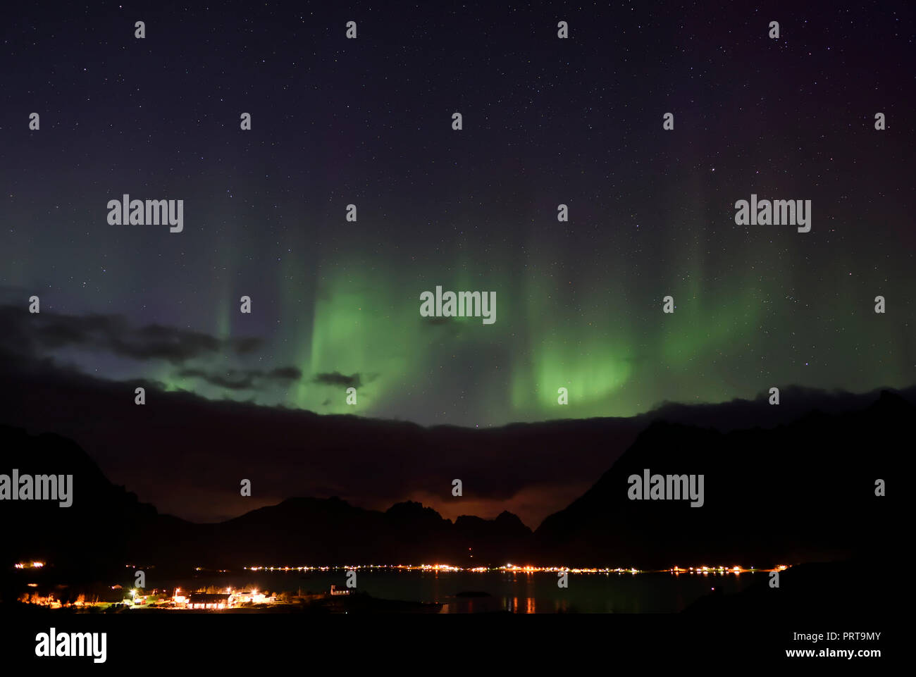 Modest display of the Aurora Borealis from Vestpollen in the Lofoten Islands, Norway Stock Photo